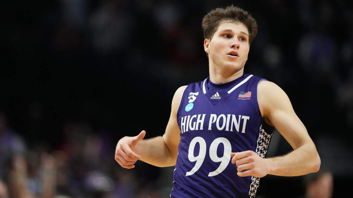 PORTLAND, OREGON - MARCH 19: Chase Johnston #99 of the High Point Panthers reacts after making a basket against the Wisconsin Badgers during the second half in the first round of the 2026 NCAA Men's Basketball Tournament at Moda Center on March 19, 2026 in Portland, Oregon. (Photo by Soobum Im/Getty Images)