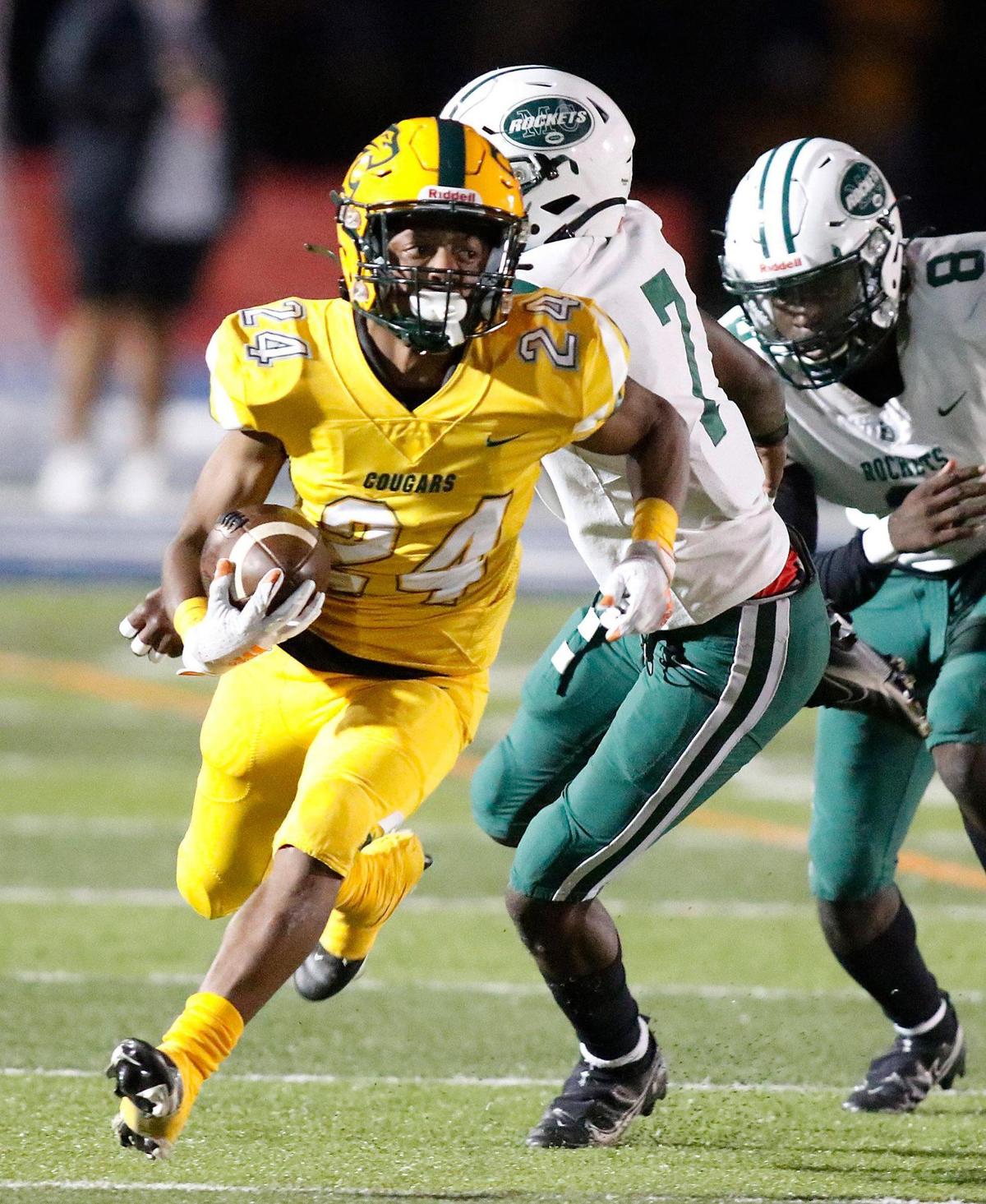 Killian Cougars running back Matthew Boston (24) runs the ball against Miami Central Rockets during the FHSAA Region 4-5A high school football championship on Saturday, November 27, 2021 at Tropical Park in Miami. Andrew Uloza / for THE MIAMI HERALD