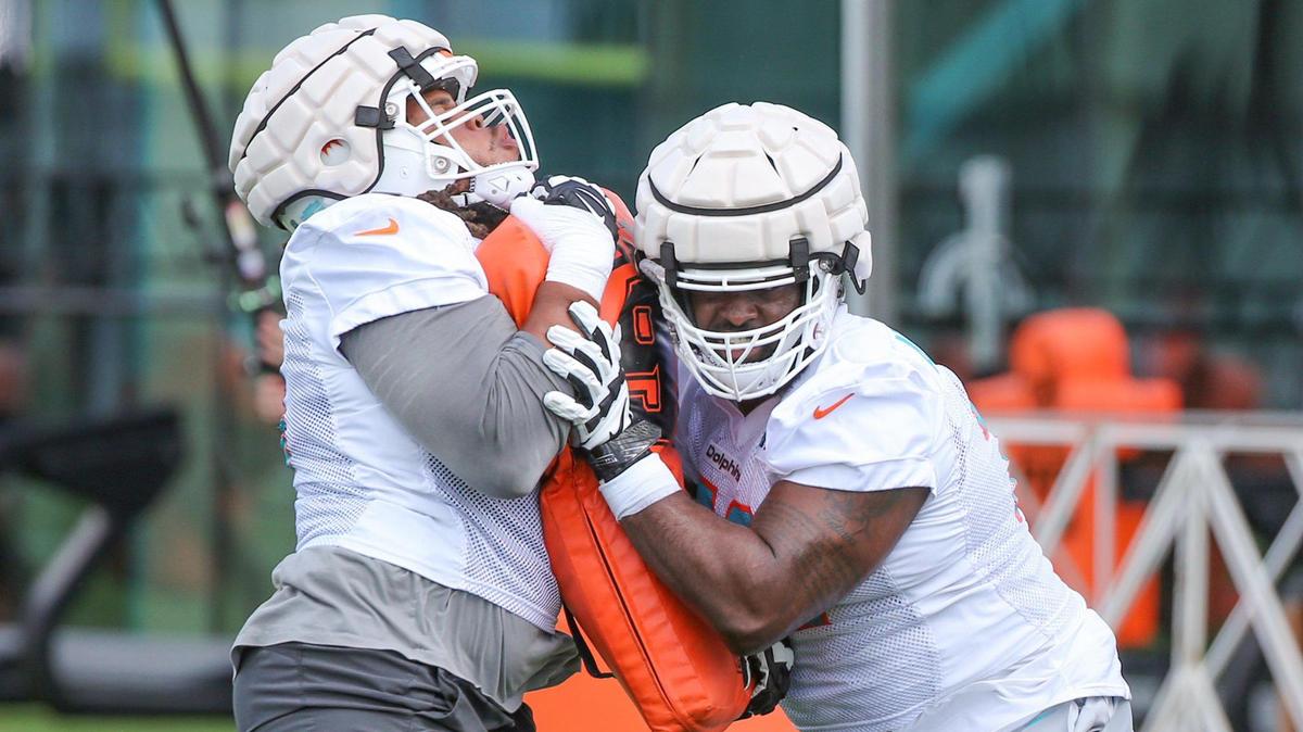 Miami Dolphins tackle Terron Armstead (72) and offensive lineman Robert Hunt (68) run drills during practice at Baptist Health Training Complex in Miami Gardens on Friday, July 29, 2022.