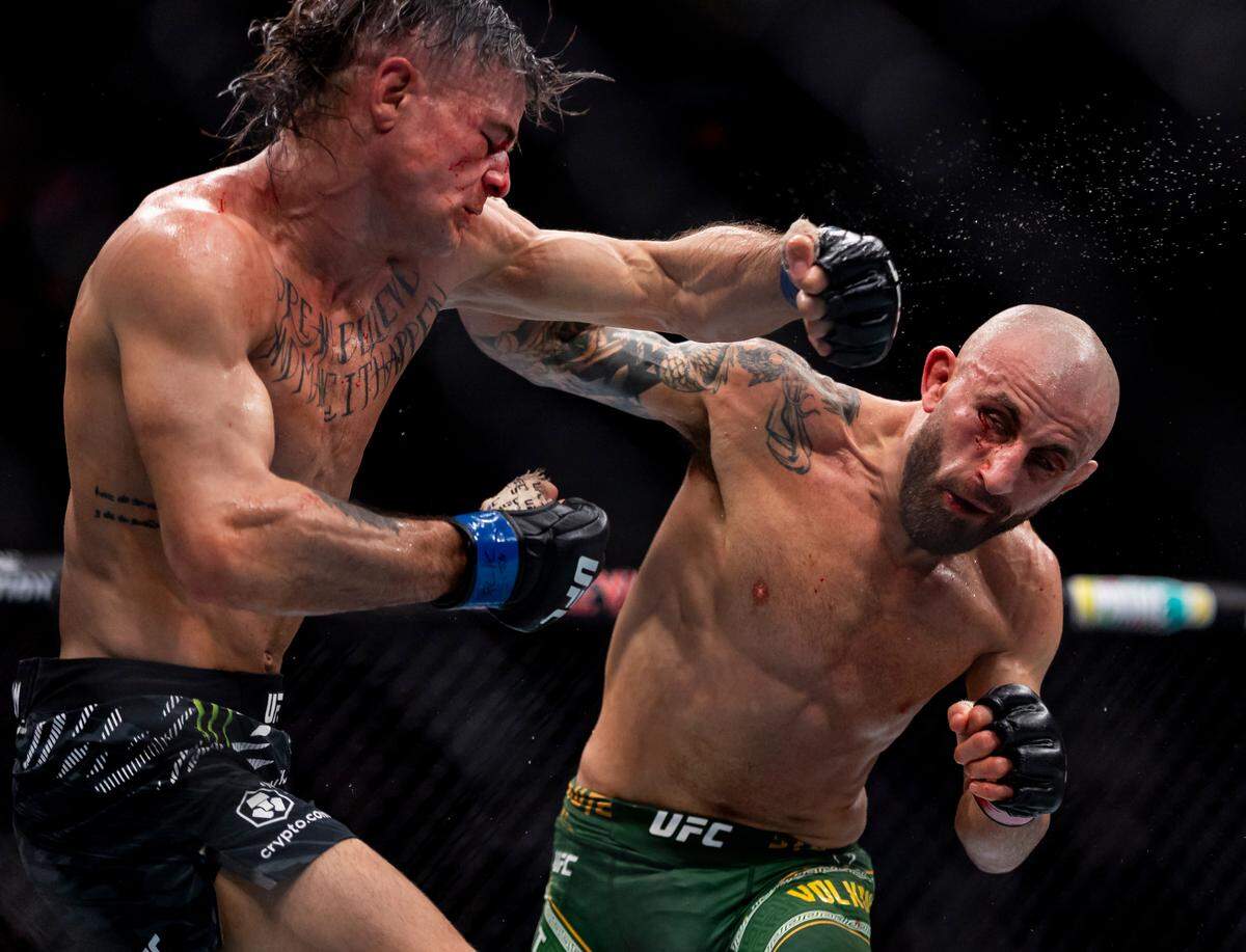 Alexander Volkanovski of Australia fights against Diego Lopes of Brazil in their featherweight title bout during UFC 314 at the Kaseya Center on Saturday, April 12, 2025, in downtown Miami, Fla.