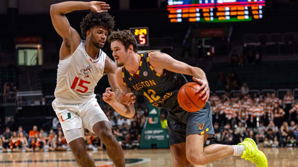 Hurricanes forward Norchad Omier (15) defends the drive by Boston College Eagles forward Quinten Post (12) during the first half at Watsco Center on March 6, 2024. The teams meet again in the first round of the ACC Tournament on March 11, 2024 in Washington, D.C.