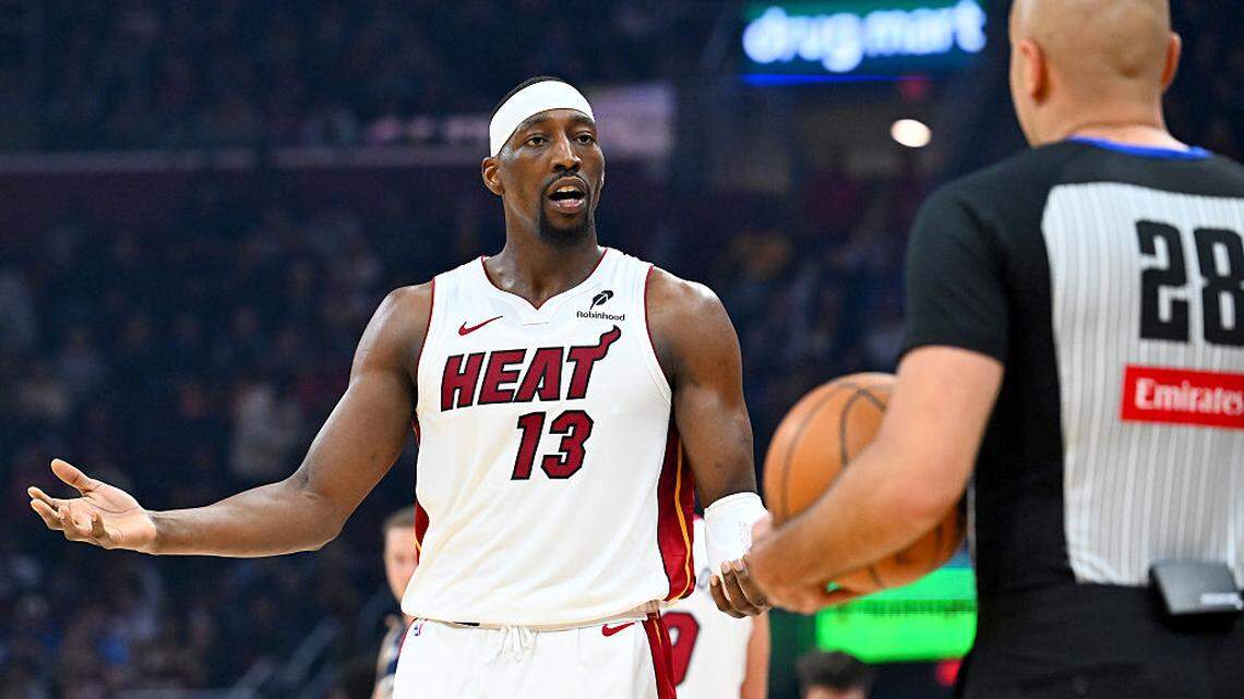 Bam Adebayo #13 of the Miami Heat argues a call with referee Mousa Dagher #28 during the second quarter at Rocket Arena on March 27, 2026 in Cleveland, Ohio.