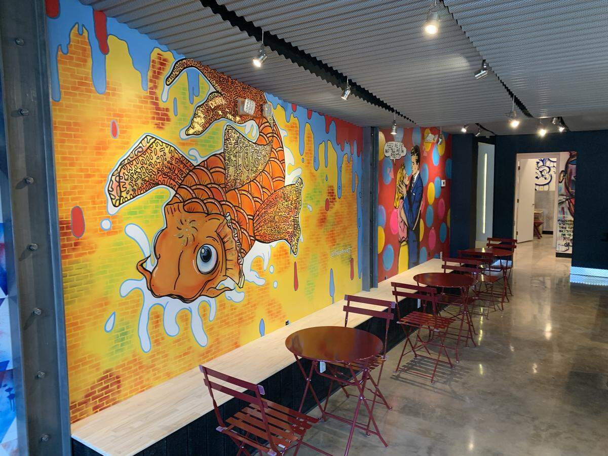 The inside of the new Fireman Derek’s Bake Shop in Coconut Grove features a colorful mural in it’s 1,100 squre-foot space.