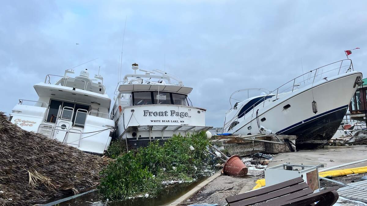 Wrecked boats in downtown Fort Myers on Thursday afternoon, one day after Hurricane Ian made landfall on Florida’s Gulf Coast.