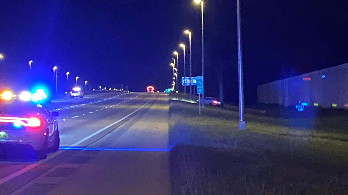 A Miami-Dade Police car is parked on the northbound shoulder of Florida’s Turnpike around mile marker 8 Tuesday morning, June 11, 2024. A car ahead of the police car is parked facing the highway on the grassy bank on the side of the road. Police say the driver of that car was shot.
