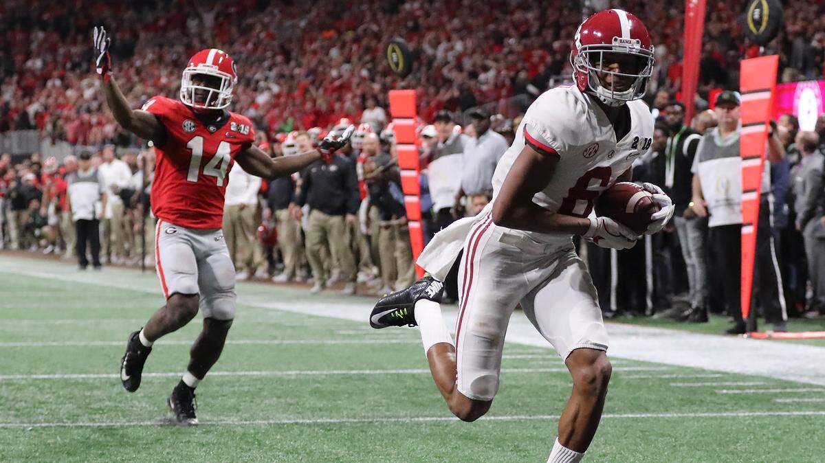 Alabama wide receiver Devonta Smith catches the game-winning touchdown pass past Georgia defensive back Malkom Parrish for a 26-23 victory during overtime of the College Football Playoff National Championship at Mercedes-Benz Stadium on Monday, Jan. 8, 2018 in Atlant, Ga.