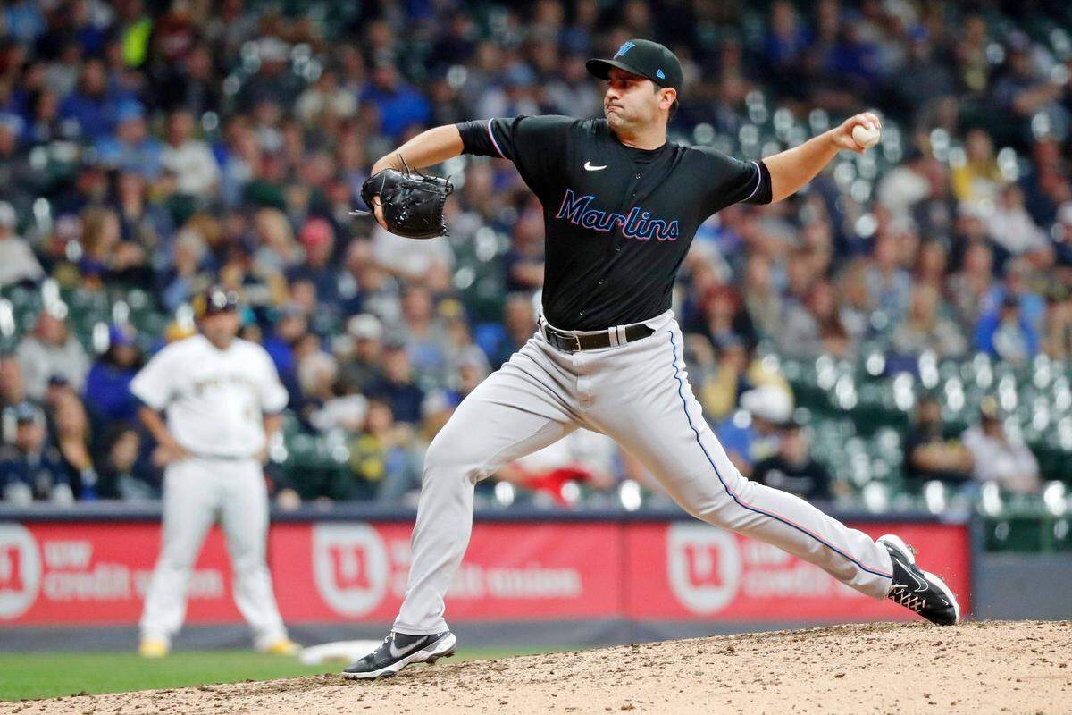 Miami Marlins relief pitcher Richard Bleier throws against the Milwaukee Brewers during the ninth inning of a baseball game Saturday, Oct. 1, 2022, in Milwaukee. (AP Photo/Jon Durr)