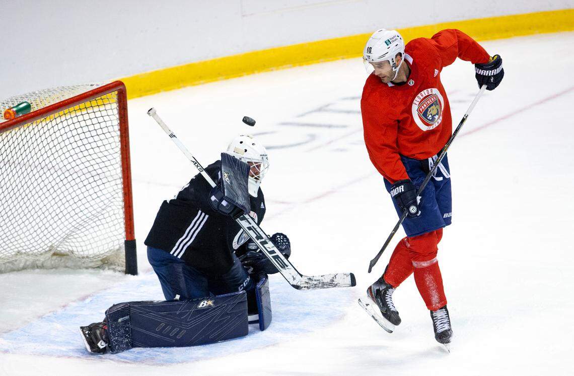Florida Panthers goalie Scott Darling (31) blocks a shot by Panthers right wing Brett Connolly (10) during the first practice of training camp in preparation for the 2020-21 NHL season at the BB&T Center on Monday, January 4, 2021 in Sunrise.