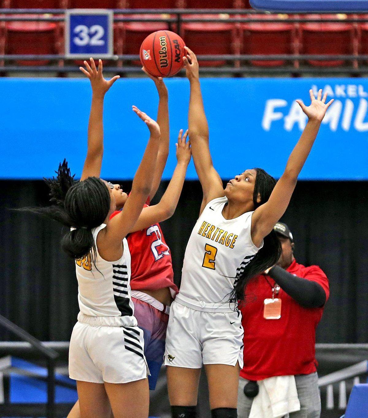 America Heritage HS Taiyah Wyche (00) and Tatyana (2) defend Pine Forest HS Danielle Luckey (23) in the 5A finals of the FHSAA Girl’s State Championships in Lakeland, Florida, February 29, 2020.