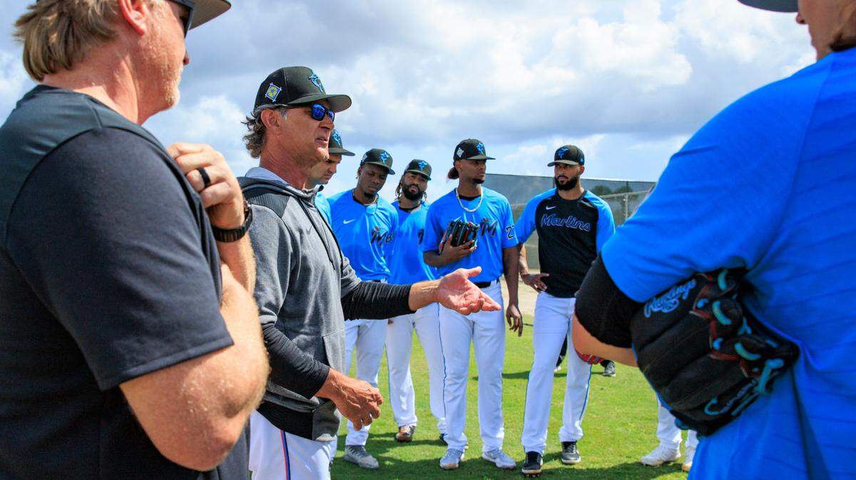 Miami Marlins manager Don Mattingly and pitching coach Mel Stottlemyre Jr talk with pitchers and catchers during their spring training workout at Roger Dean Stadium on Wednesday, March 16, 2022 in Jupiter, FL.