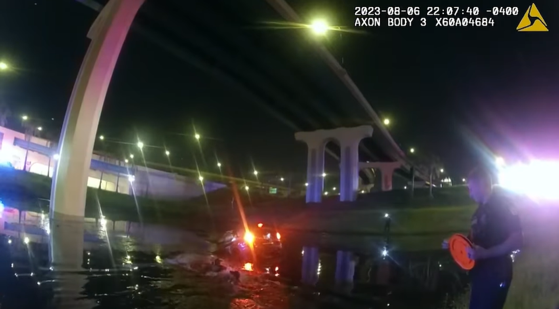 Officers used a rope to help pull the driver to shore, body camera footage showed.