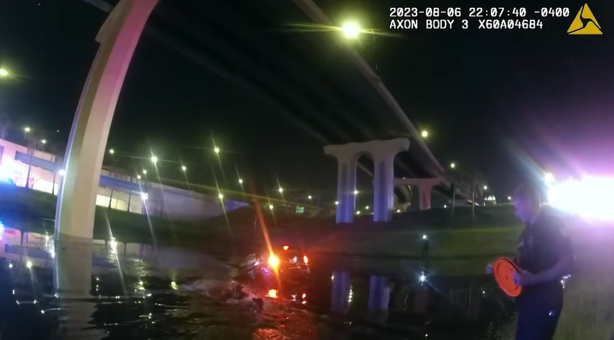 Officers used a rope to help pull the driver to shore, body camera footage showed.