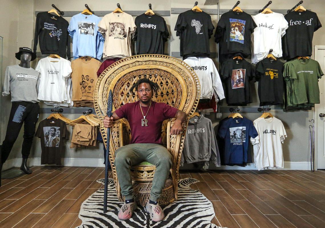 Danny Agnew, the co-founder of Roots Collective, reenacts the famous picture of Huey P. Newton inside the Roots Collective Black House located on the 5400 block of 7th Avenue in Miami, Florida on Wednesday, March 16, 2022. From having their own Black empowerment apparel line to hosting youth enrichment summer camps to renting out their event space, Roots Collective does a little bit of everything.