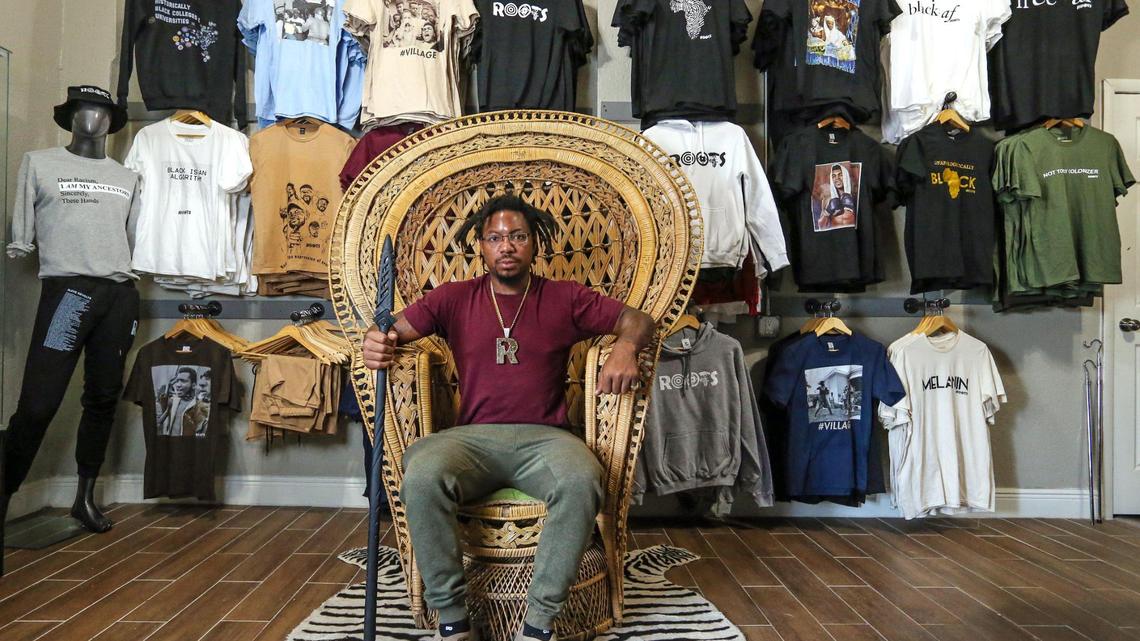 Danny Agnew, the co-founder of Roots Collective, reenacts the famous picture of Huey P. Newton inside the Roots Collective Black House located on the 5400 block of 7th Avenue in Miami, Florida on Wednesday, March 16, 2022. From having their own Black empowerment apparel line to hosting youth enrichment summer camps to renting out their event space, Roots Collective does a little bit of everything.
