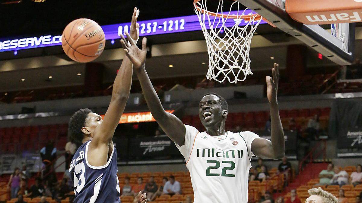 UM Hurricanes ‘s forward Deng Gak (22) battles for a rebound  during the Hoophall Miami Invitational basketball game against Yale Bulldogs on Saturday, Dec.1, 2018 at American Airlines Arena in Miami