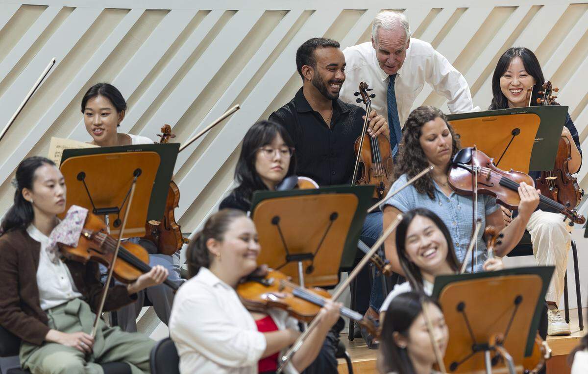 Howard Herring, president and CEO of the New World Symphony, top right, speaks with fellows during a rehearsal break at the New World Center on Tuesday, Sept. 2, 2025, in Miami Beach, Fla.