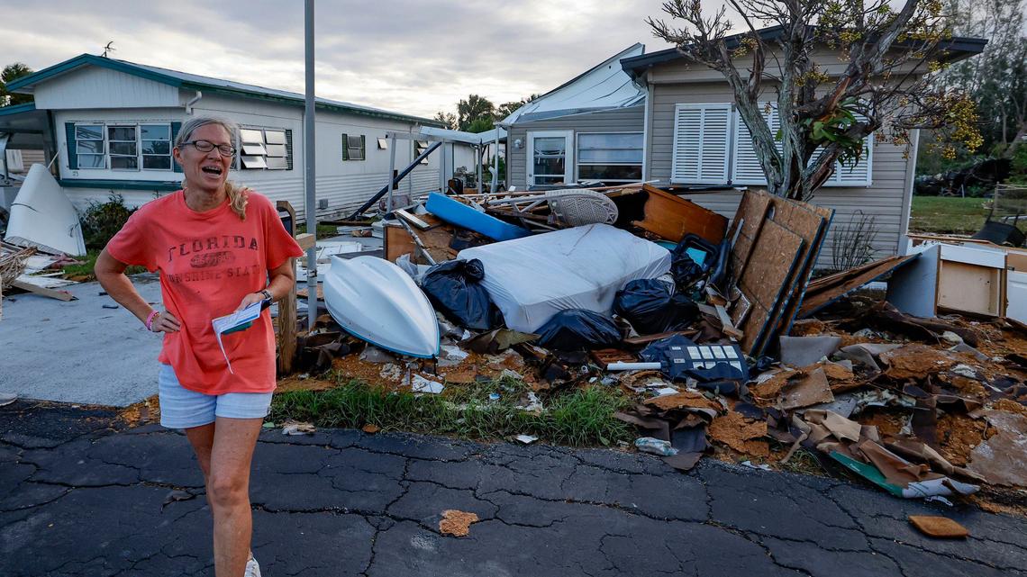Cindy Herman reacts as she inspects the damage of her home caused by Hurricane Milton and Hurricane Helene two weeks before at Venice Bay Adult Park in Venice, Florida on Thursday, October 10, 2024.