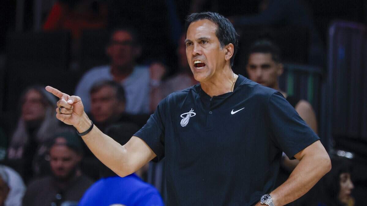 Miami Heat Head Coach Erik Spoelstra signals towards the court during the first half of the NBA basketball game against the Milwaukee Bucks at Kaseya Center in Miami on March 12, 2026.