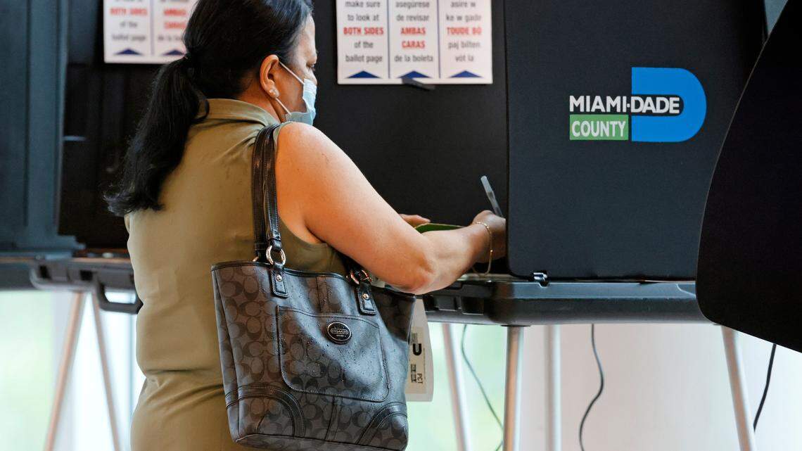 A voter casts her vote during the Miami General Municipal and Special Elections in Miami-Dade County at the Jose Marti Gym on Tuesday, Nov. 2, 2021.