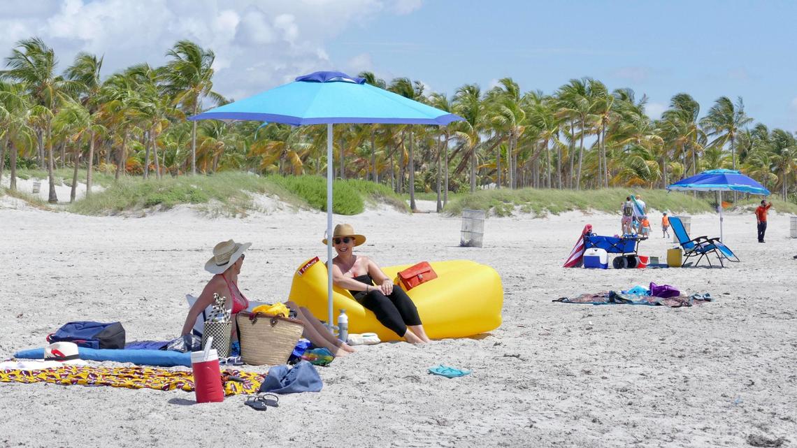 Aurelie Pratt of Miami Shores and Lea Grandvalet of Coconut Grove visit Crandon Park’s southern beach on the first weekend of beaches being open in Miami-Dade.