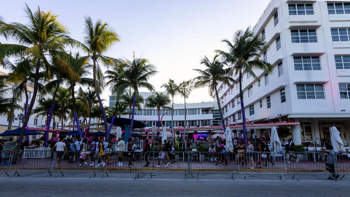 People walk past the Clevelander Bar and Hotel on May 28, 2023.