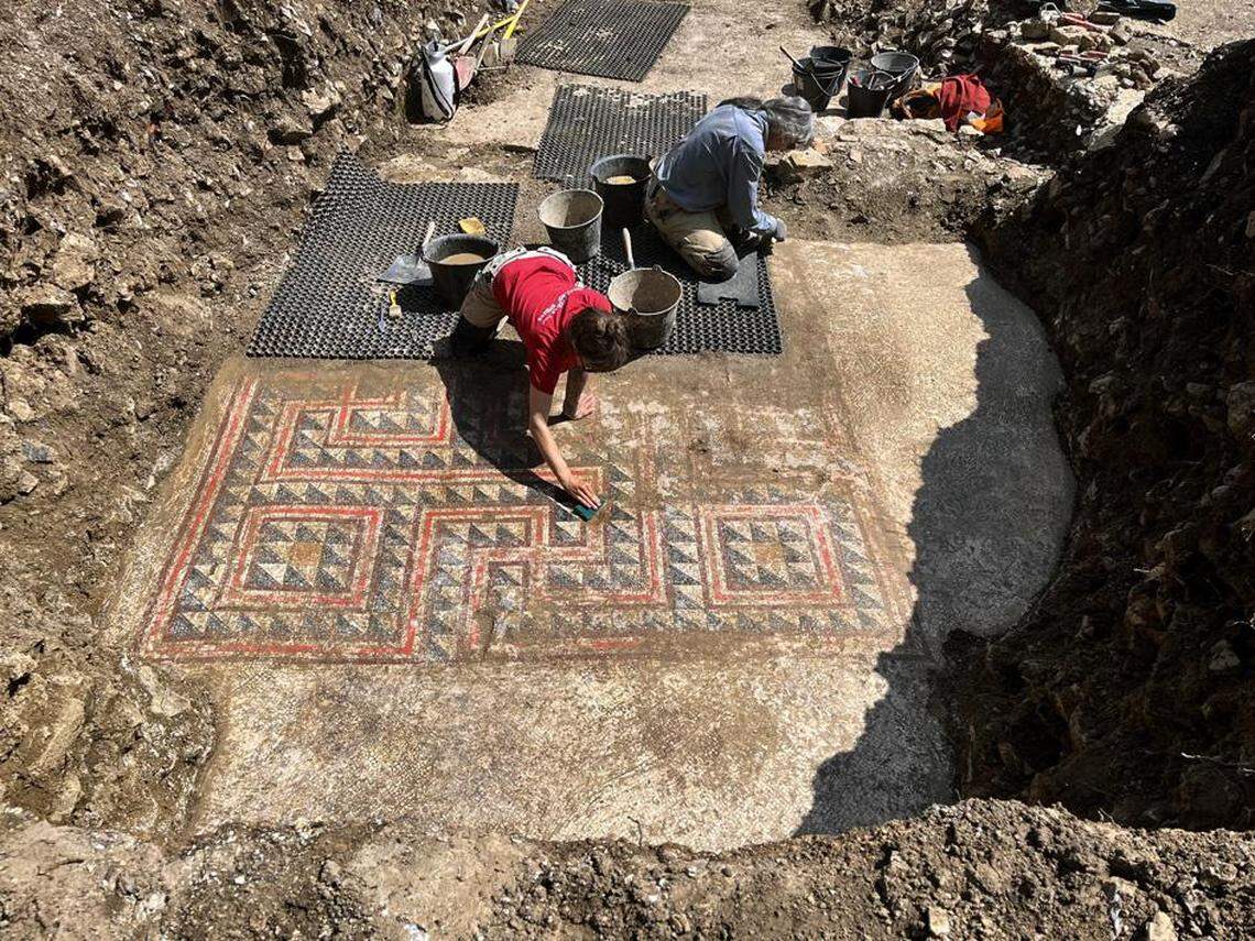 An elaborate mosaic using black, white and red tiles was found in one of the dwellings, archaeologists said.