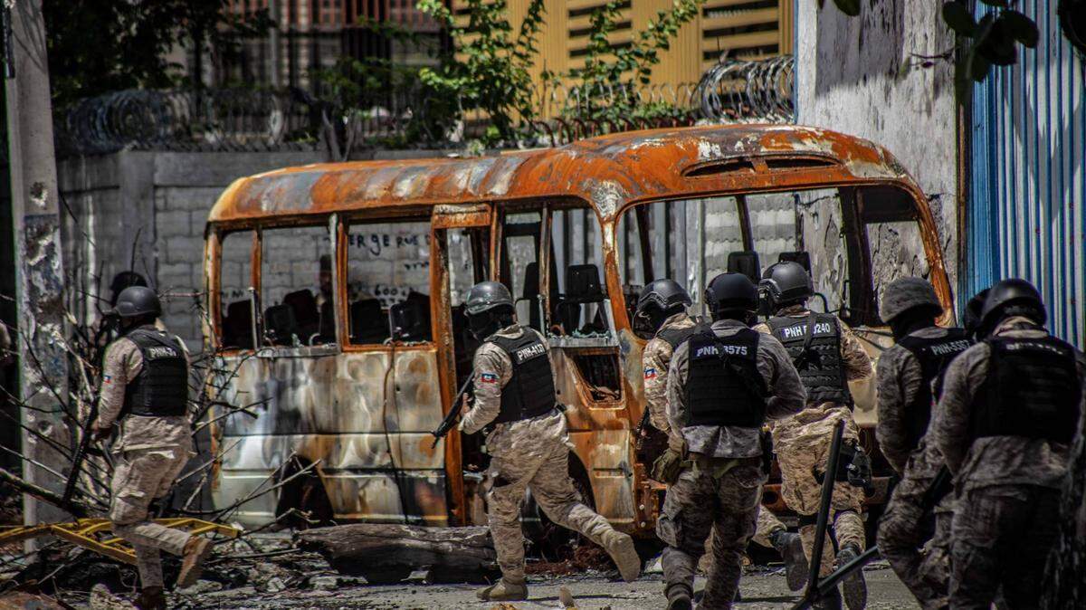 As the Kenyan police arrived, Haitian police patrol near the State University of Haiti Hospital near downtown Port-au-Prince in July 2024.