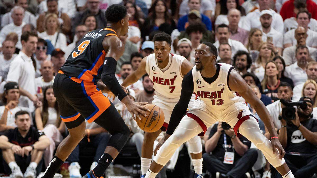 Miami Heat center Bam Adebayo (13) and guard Kyle Lowry (7) defend against New York Knicks guard RJ Barrett (9) in the second quarter of Game 4 of the NBA Eastern Conference Semifinals at the Kaseya Center in Miami on Monday, May 8, 2023.