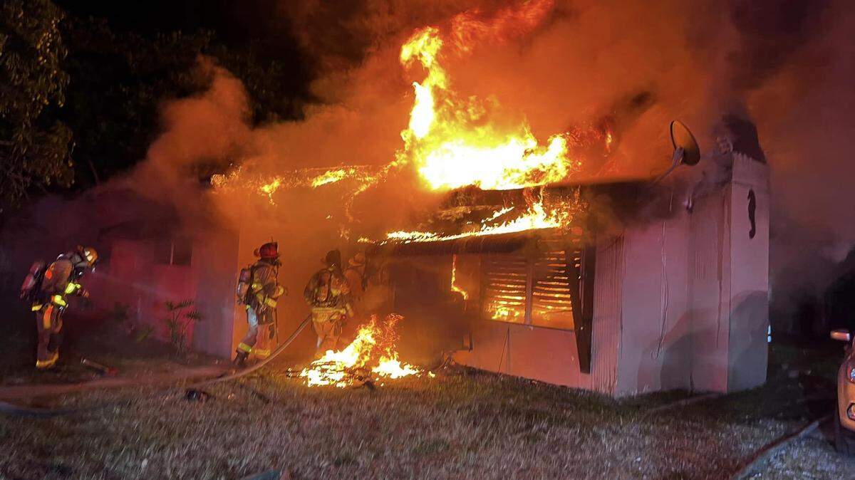A home in the 1200 block of Northwest 15th Street in Fort Lauderdale is engulfed around 3 a.m. May 13, 2023. Seven people inside were able to get out. Two were taken to the hospital for smoke and heat exposure, according to Fort Lauderdale Fire Rescue.