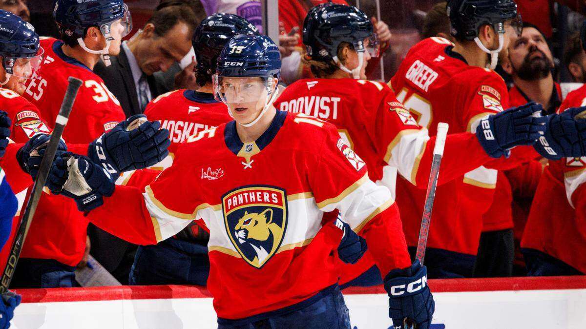 Florida Panthers center Anton Lundell (15) high-fives the bench after scoring a goal during the second period of a game on Thursday, Oct. 17, 2024, at Amerant Bank Arena in Sunrise, Fla.