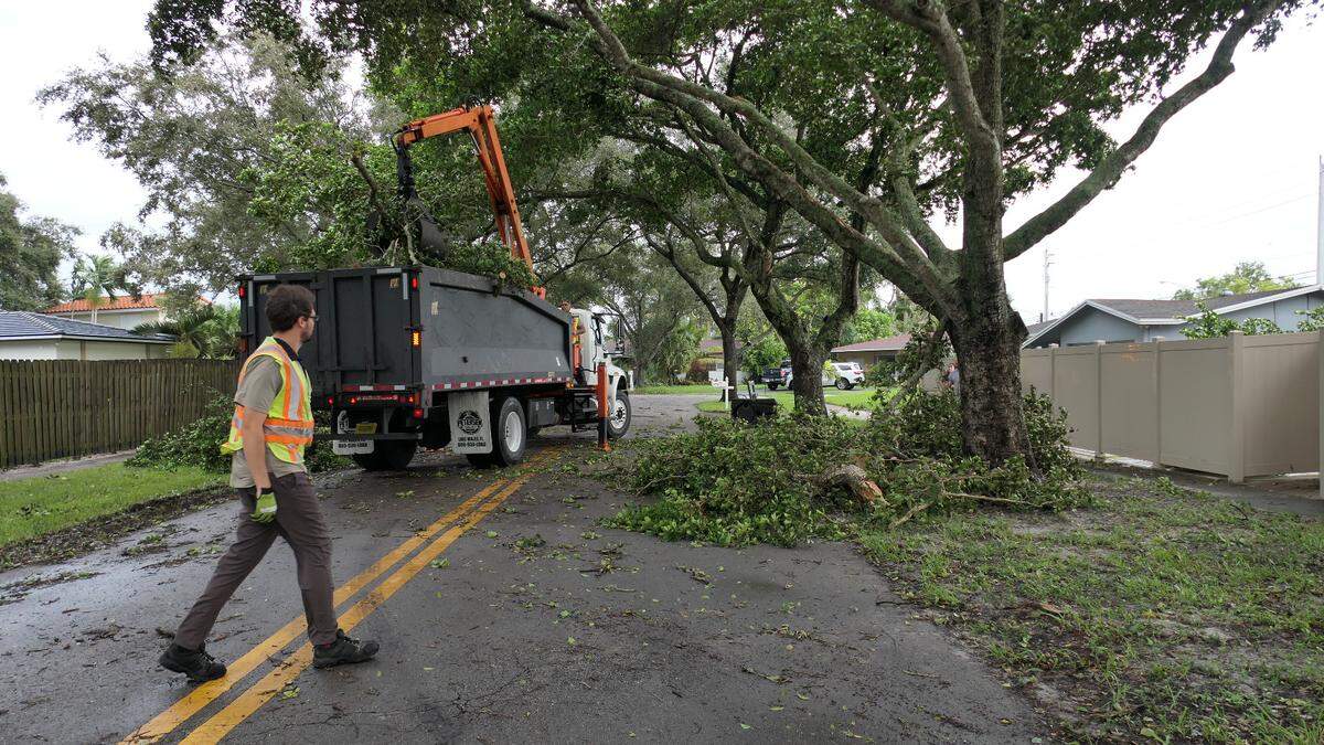 Wednesday morning cleanup in Cooper City after two tornadoes hit the Broward County city on Tuesday.