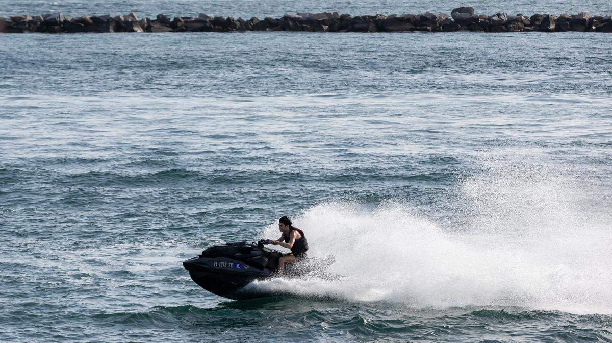 A jet skier makes his way past South Pointe Park Pier during spring break on Friday, March 8, 2024, in Miami Beach, Fla.&nbsp;