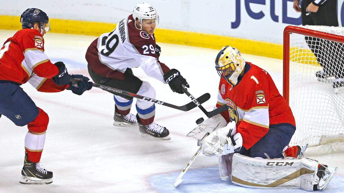 Florida Panthers goalie Roberto Luongo (1) stop a shot by Colorado Avalanche center Nathan MacKinnon (29) during the first period of an NHL regular season hockey game at the BB&T Center on Thursday, Dec. 6, 2018 in Sunrise.