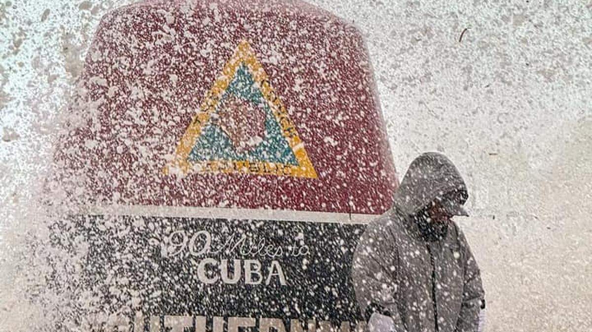 A man gets sprayed by seawater from Hurricane Helene as he stands by the Southernmost Point Buoy in Key West Thursday, Sept. 26, 2024.
