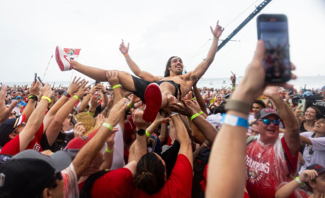 Florida Panthers left wing Ryan Lomberg (94) jumps into the crowd during a Stanley Cup victory parade rally at the Fort Lauderdale Beach Park off A1A on Sunday, June 30, 2024, in Fort Lauderdale, Fla. The parade was held to celebrate the Florida Panthers after they defeated the Edmonton Oilers in Game 7 of the Stanley Cup Final.