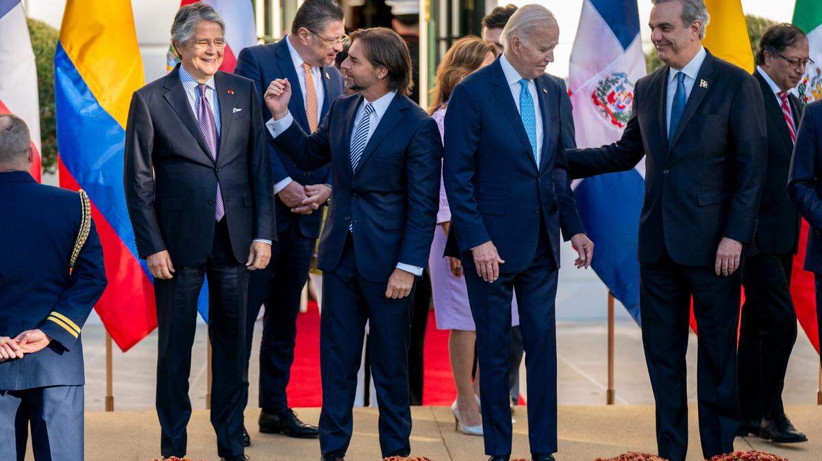 U.S. President Joe Biden, second right, President Luis Abinader of the Dominican Republic, right, President Luis Lacalle Pou of of Uruguay, second left, and President of Ecuador Guillermo Lasso, left, arrive for the family photo at the inaugural Americas Partnership for Economic Prosperity Leaders Summit on the South Portico of the White House in Washington, D.C., on November 3, 2023. The summit aimed at deepening the mutual benefit in trade, manufacturing, immigration and other sectors among the Western Hemisphere nations.