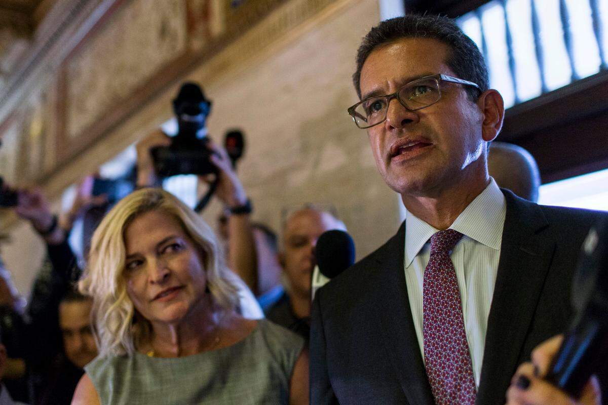 Pedro Pierluisi, who has been nominated to be Puerto Rico’s Secretary of State, arrives at the Senate with his sister Caridad Pierluisi, his spokesperson, in San Juan, Puerto Rico, on Thursday, Aug. 1, 2019. Puerto Rican politics were in full-blown crisis as confirmation of Pierluisi, who would succeed departing Gov. Ricardo Rosselló, was delayed into next week, casting doubt over who will become governor when Rosselló leaves office.