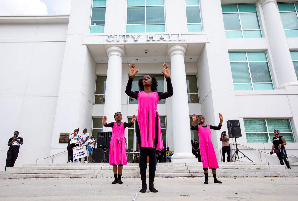 Miami Purple Church Dancers, Shaniya Bradford, 17, center, Shayla Williams, 9, left, and Breanna Bien-Aime, 9, perform in front of Homestead City Hall during a peaceful protest for Black Lives Matter on Sunday, June 7, 2020.