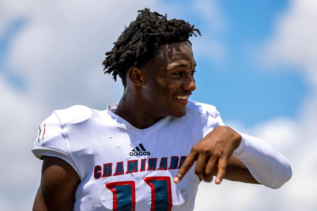 Chaminade-Madonna quarterback Cedric Bailey (11) makes the ‘horns down’ gesture while up 42-14 during the fourth quarter of a high school football game against Miami Northwestern Senior High at Nathaniel Traz Powell Stadium in Westview, Florida, on Saturday, September 10, 2022.