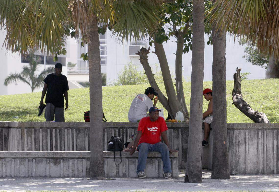 5/22/08 RONNA GRADUS / MIAMI HERALD STAFF Homeless people gather at Bicentennial Park in Downtown Miami. (3 of 3 photos)