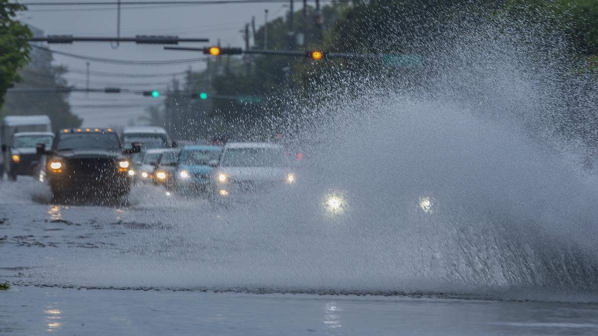Commuters drive through flooded roadways on Southwest 67th Avenue as heavy and torrential downpours from strong thunderstorms swept through South Florida on Sept. 9, 2025.