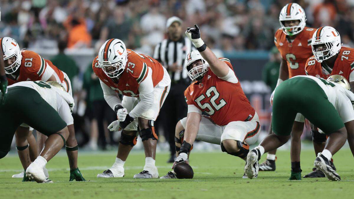 Miami Hurricanes offensive lineman James Brockermeyer (52) gestures before snaping the ball during the NCAA football game against the South Florida Bulls at Hard Rock Stadium in Miami Gardens, Florida, on Saturday, September 13, 2025.