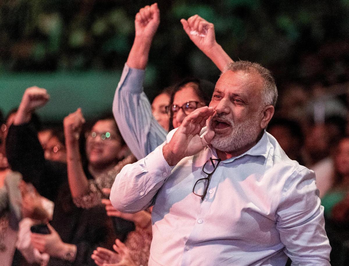 Dr. Abid Sami cheers for his daughter Iman as she speaks to her class during commencement ceremonies at the Watsco Center in the University of Miami. “Sitting here, it makes you realize it was all worth it,” he said, after confessing it was “hard” to send her daughter across the Atlantic four years ago. “It was a big moment for us,” he said. “But we’re so, so proud.”