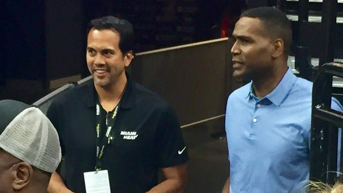 Miami Heat coach Erik Spoelstra, left, talks to agent Joe Branch, who represents forward Justise Winslow, during the team's summer league game against the Sacramento Kings on Thursday, July 5, 2018 at Golden 1 Center.