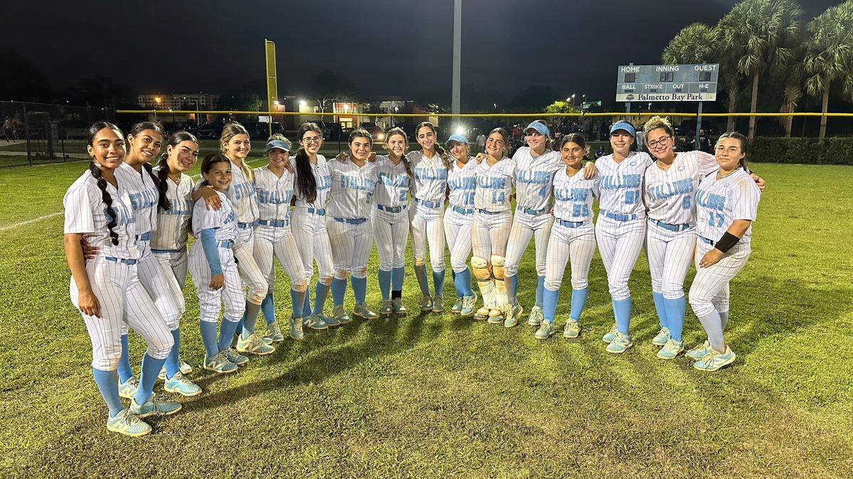 The Somerset Silver Palms softball team celebrates after defeating Cardinal Gibbons 11-0 in a Region 4-3A semifinal at Palmetto Bay Park on Tuesday night.
