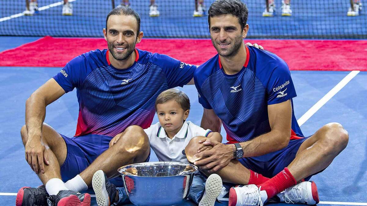 Juan Sebastian Cabal (left) and Robert Farah (right) of Colombia won the 2019 U.S. Open men’s doubles title, the first South Americans ever to do so. Cabal’s son, Jacobo, joined the celebration.