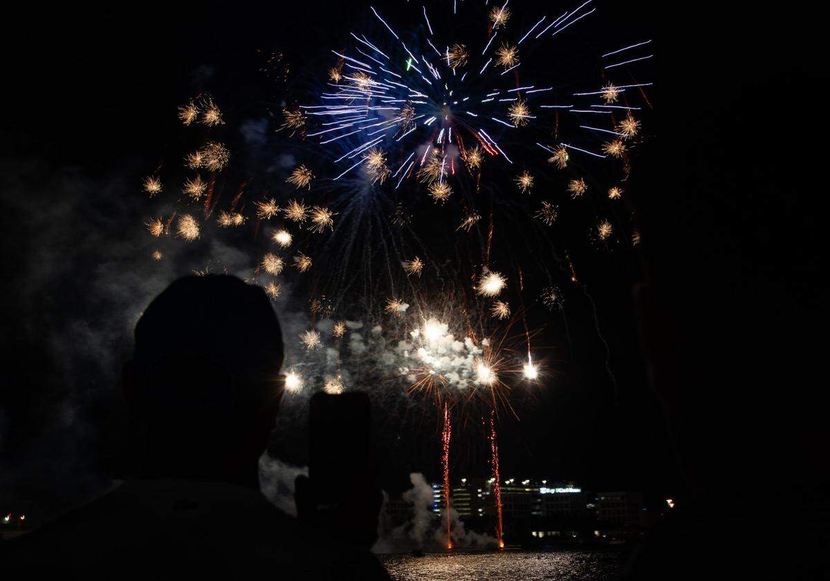 Attendees watch the fireworks during the Fourth of July Bayfront Park Celebration at Bayfront Park on Tuesday, July 4, 2023 in Miami, Fla.