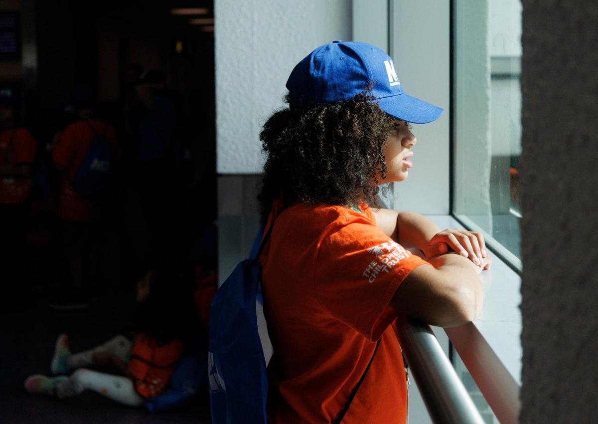 Sophia Pierre, 10, who is mostly non-verbal, stares out the window during an airport readiness drill with Easterseals South Florida kids to prepare them for experiencing air travel on Tuesday, July 23, 2024, at Miami International Airport. Many of the kids have autism or other disabilities that can make airports stressful, so this tour showed them what it was like.