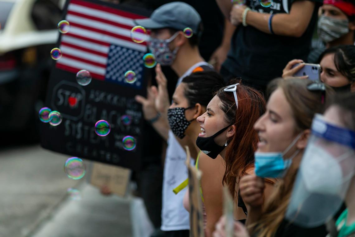 Protesters and Florida Highway Patrol officers meet on one of the ramps of the Julia Tuttle Causeway on Friday, June 5, 2020, during a Justice for George Floyd rally that began in Wynwood.