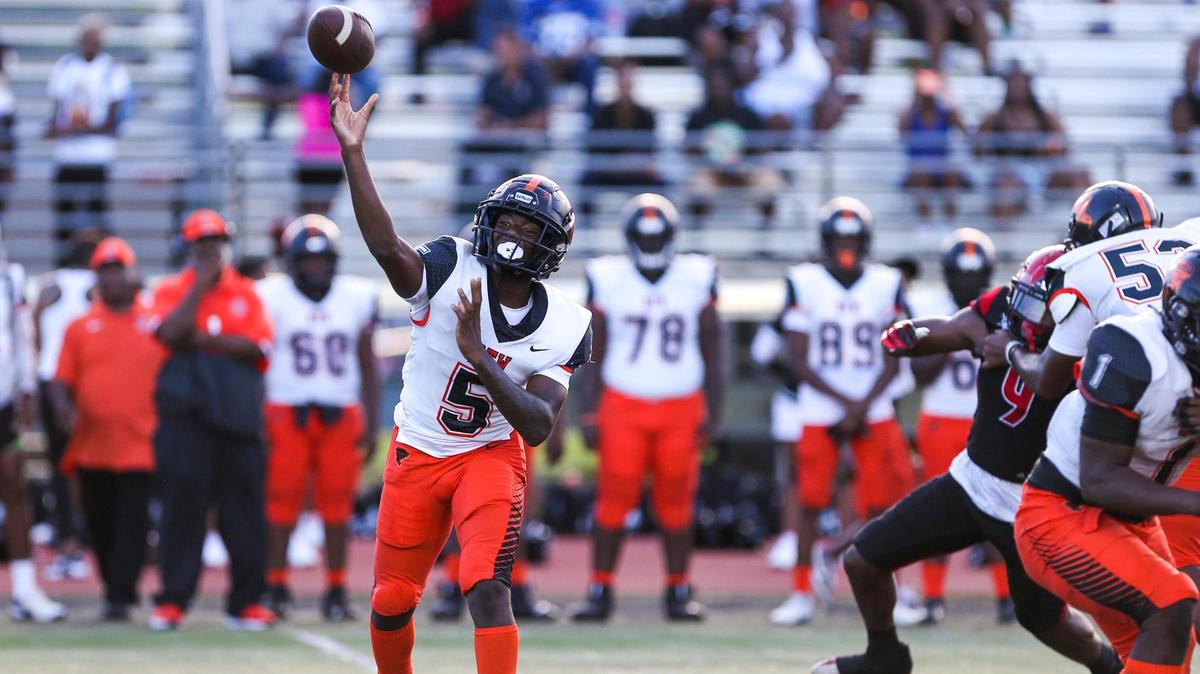 Booker T. Washington quarterback Claudell Sherman (5) throws the football during the first quarter of a high school football game against Miami Edison at Curtis Park in Miami, Florida, on Thursday, September 1, 2022.